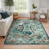 Covaba bohemian floral medallion area rug in teal haze, styled in a room setting, view 11