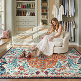 Covaba bohemian floral medallion area rug in amber clay, styled in a room setting, view 7