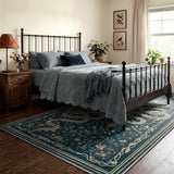 Covaba mystical snake area rug in stormy blue, styled in a room setting, view 4