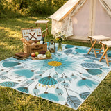 Covaba floral indoor outdoor area rug in stormy blue, styled in a room setting, view 4