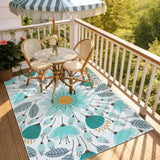 Covaba floral indoor outdoor area rug in stormy blue, styled in a room setting, view 5
