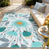 Covaba floral indoor outdoor area rug in stormy blue, styled in a room setting, view 3