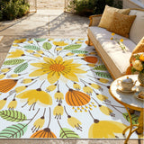 Covaba floral indoor outdoor area rug in golden wheat, styled in a room setting, view 6