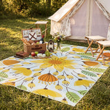 Covaba floral indoor outdoor area rug in golden wheat, styled in a room setting, view 4