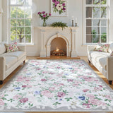 Covaba romantic vintage floral rose garden area rug in muted plum, styled in a room setting
