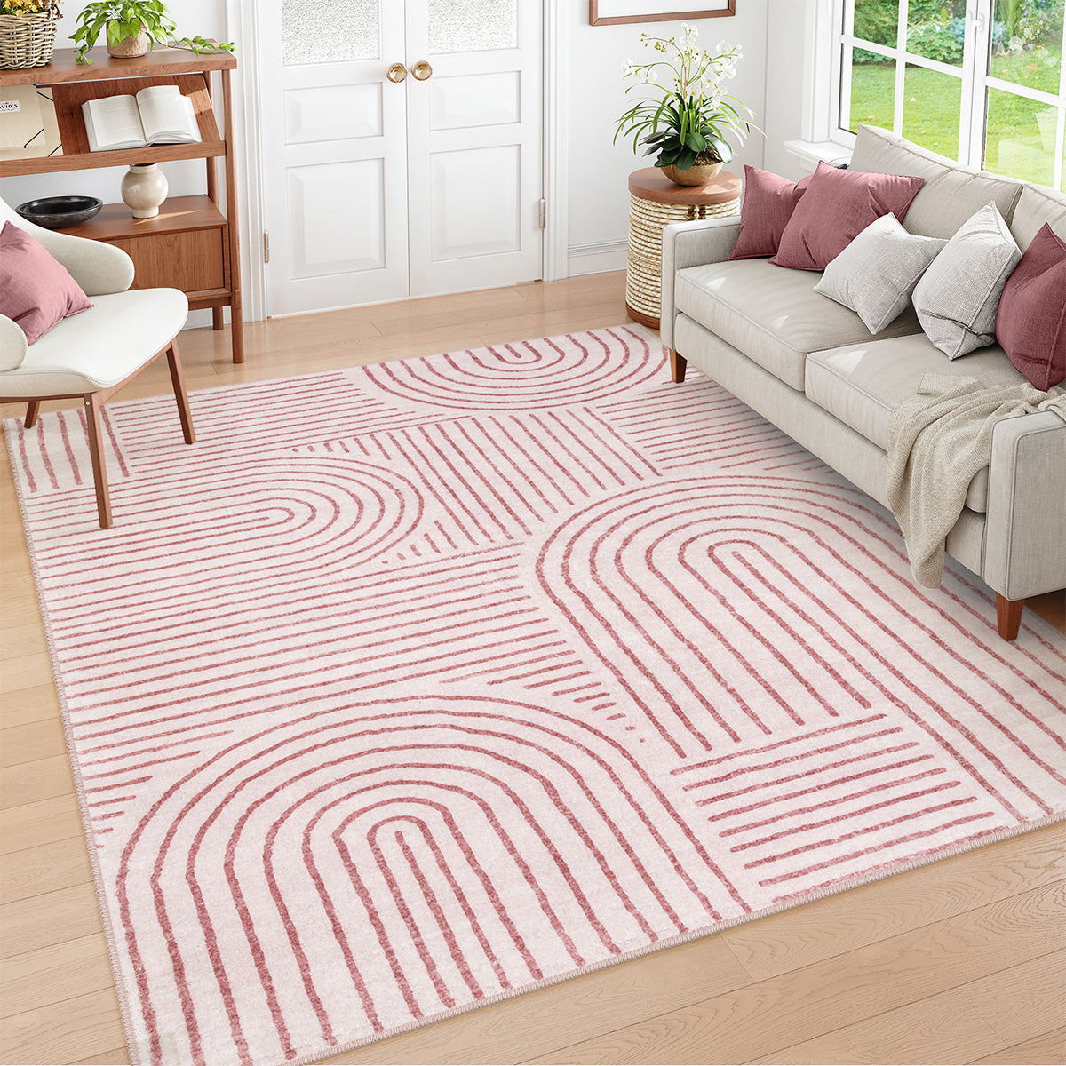 Covaba abstract rainbow stripe pink/white area rug in blush clay, styled in a room setting