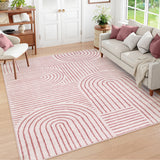 Covaba abstract rainbow stripe pink/white area rug in blush clay, styled in a room setting
