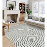 Covaba abstract rainbow stripe black/beige area rug in warm beige, shown flat on a plain ivory backdrop, view 2