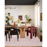 Covaba abstract rainbow stripe pink/white area rug in blush clay, shown flat on a plain ivory backdrop, view 3