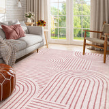 Covaba abstract rainbow stripe pink/white area rug in blush clay, styled in a room setting, view 11