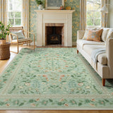 Covaba vintage floral area rug in sage mist, styled in a room setting