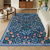 Covaba maximalism vibrant floral area rug in stormy blue, styled in a room setting