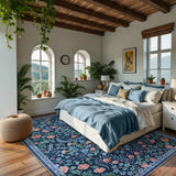 Covaba maximalism vibrant floral area rug in stormy blue, styled in a room setting, view 2