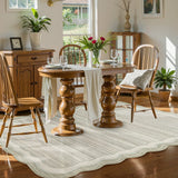 Covaba modern abstract bordered scalloped area rug in warm beige, styled in a room setting, view 7