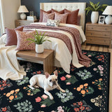 Covaba meadow floral area rug in ink black, styled in a room setting, view 3