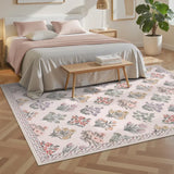 Covaba meadow floral area rug in blush clay, styled in a room setting, view 4