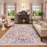 Covaba maximalism vibrant blossom floral area rug in blush clay, styled in a room setting, view 2