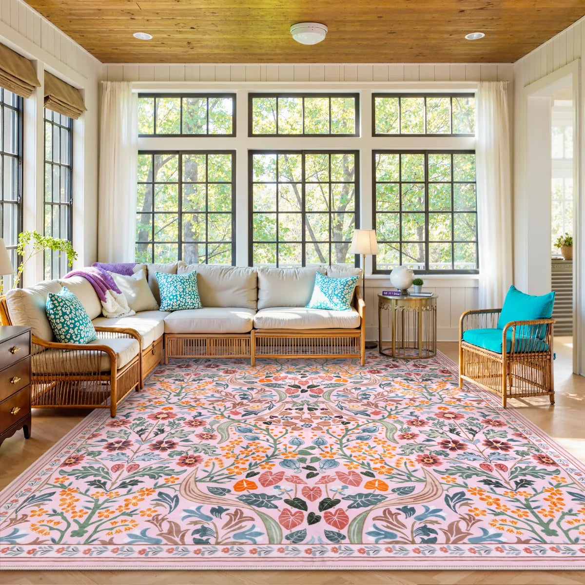 Covaba maximalism vibrant blossom floral area rug in blush clay, styled in a room setting
