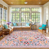 Covaba maximalism vibrant blossom floral area rug in blush clay, styled in a room setting