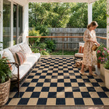 Covaba checkered easy jute natural indoor/outdoor area rug in ink black, styled in a room setting, view 3