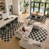 Covaba checkered easy jute natural indoor/outdoor area rug in ink black, styled in a room setting, view 12
