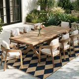 Covaba geometric checkered easy jute indoor/outdoor area rug in ink black, styled in a room setting, view 2