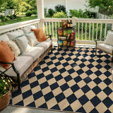 Covaba geometric checkered easy jute indoor/outdoor area rug in ink black, styled in a room setting, view 4