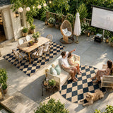 Covaba geometric checkered easy jute indoor/outdoor area rug in ink black, styled in a room setting, view 9