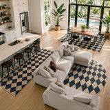 Covaba geometric checkered easy jute indoor/outdoor area rug in ink black, styled in a room setting, view 11