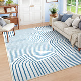 Covaba abstract rainbow stripe blue/white area rug in stormy blue, styled in a room setting, view 6