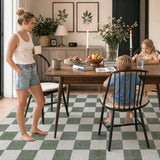 Covaba modern checkerboard area rug in olive grove, styled in a room setting, view 3