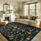 Covaba boho botanical floral area rug in ink black, styled in a room setting