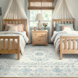 Covaba vintage traditional floral area rug in stormy blue, styled in a room setting, view 2
