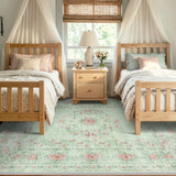 Covaba vintage traditional floral area rug in fern green, styled in a room setting