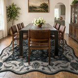 Covaba vintage botanical scalloped area rug in ink black, styled in a room setting, view 3