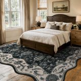 Covaba vintage botanical scalloped area rug in ink black, styled in a room setting, view 5