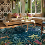 Covaba jungle midnight area rug in stormy blue, styled in a room setting, view 7