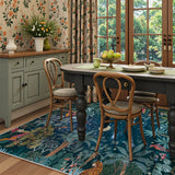 Covaba jungle midnight area rug in stormy blue, styled in a room setting, view 8