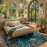 Covaba jungle midnight area rug in stormy blue, styled in a room setting, view 9