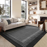 Covaba modern minimalist line area rug in ink black, styled in a room setting