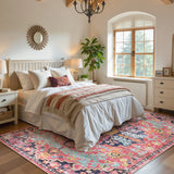 Covaba bohemian floral medallion area rug in faded rose, styled in a room setting, view 2