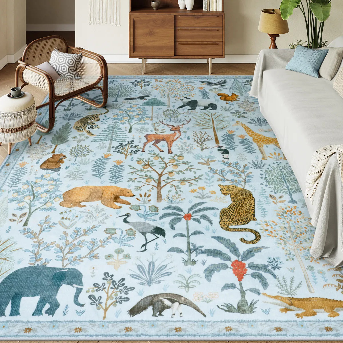 Covaba jungle animals area rug in stormy blue, styled in a room setting