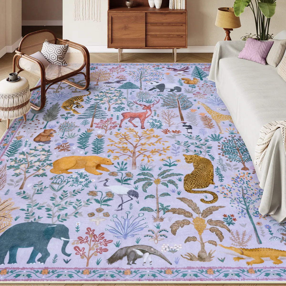 Covaba jungle animals area rug in muted plum, styled in a room setting
