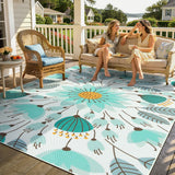 Covaba floral indoor outdoor area rug in stormy blue, styled in a room setting, view 7