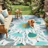 Covaba floral indoor outdoor area rug in stormy blue, styled in a room setting, view 8