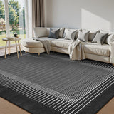 Covaba modern minimalist line area rug in ink black, styled in a room setting, view 6