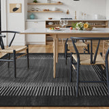 Covaba modern minimalist line area rug in ink black, styled in a room setting, view 8