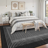 Covaba modern minimalist line area rug in ink black, styled in a room setting, view 7