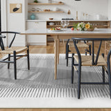 Covaba modern minimalist line area rug in pearl grey, styled in a room setting, view 7
