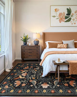 Covaba boho birdsong floral garden area rug in ink black, styled in a room setting, view 15